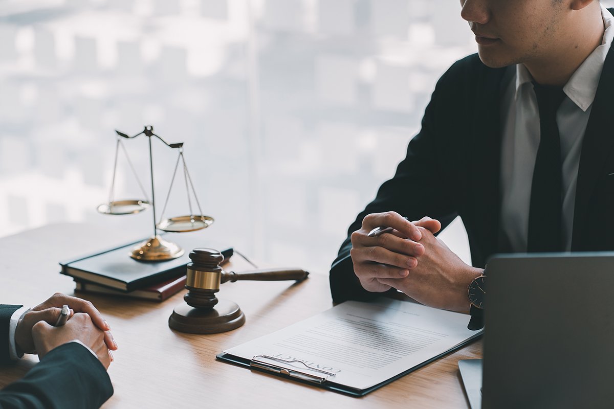 A lawyer consulting with a client in an office