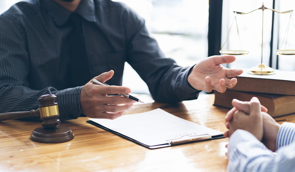 A lawyer consulting with their client over the cost of expungement in Texas