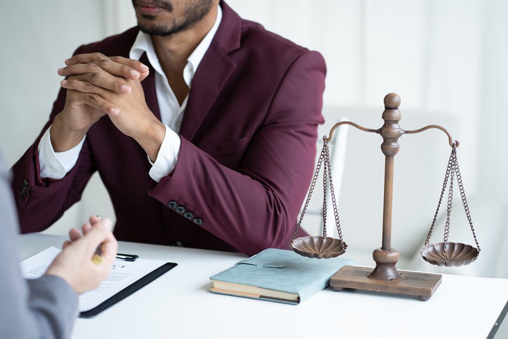 A young lawyer consulting with their client
