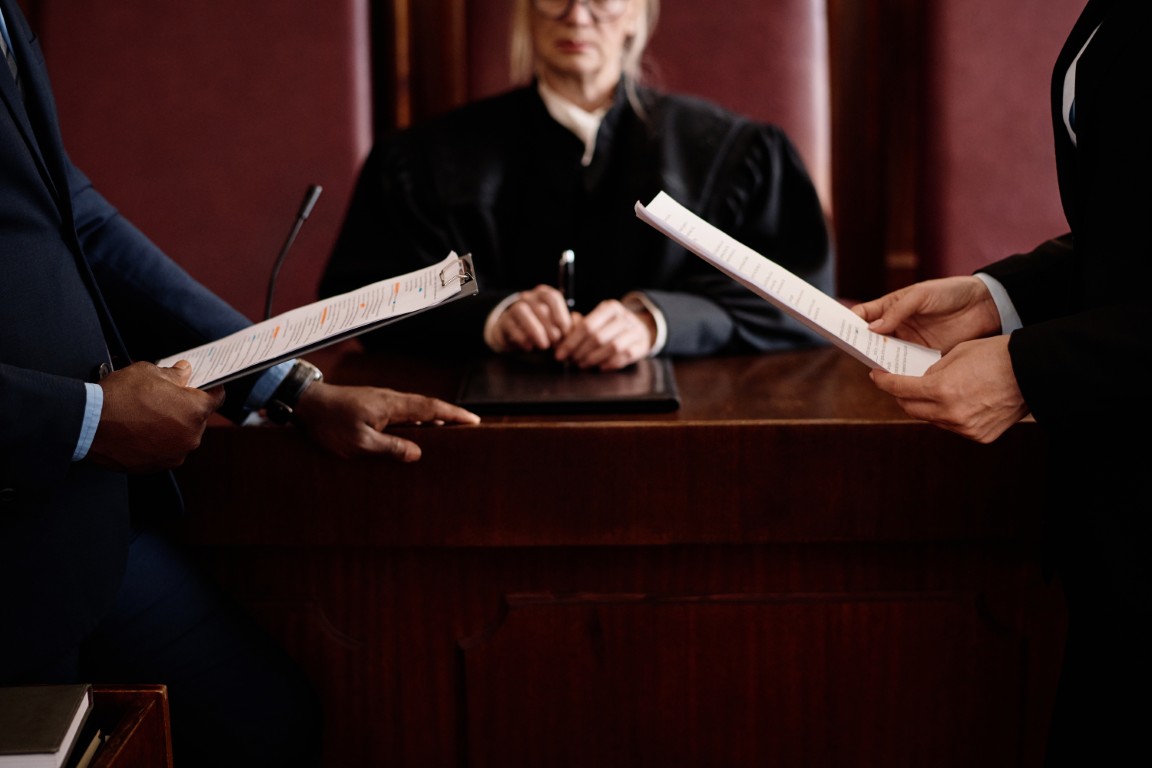 A close-up of a woman holding a gun